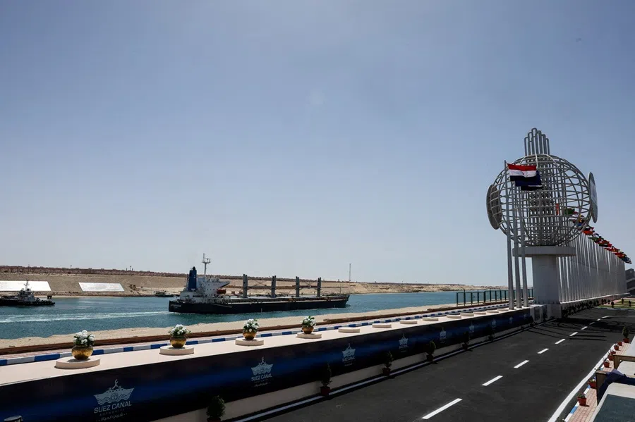 A ship moves through the Suez Canal in Ismalia, Egypt, on 16 April 2025. (Amr Abdallah Dalsh/Reuters)