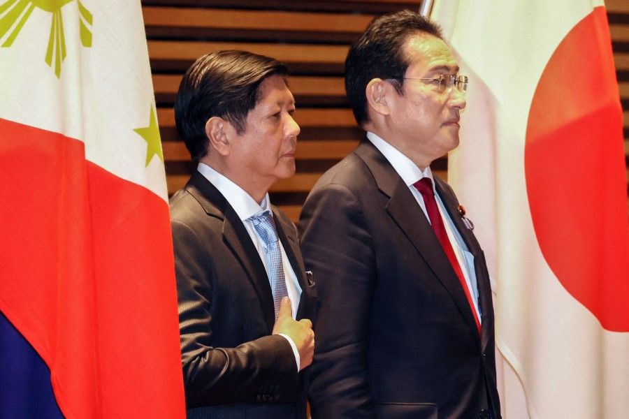Philippines President Ferdinand Marcos Jr (left) and Japanese Prime Minister Fumio Kishida (right) listen to their national anthems at the prime minister's official residence in Tokyo on 9 February 2023. (Yoshikazu Tsuno/AFP)
