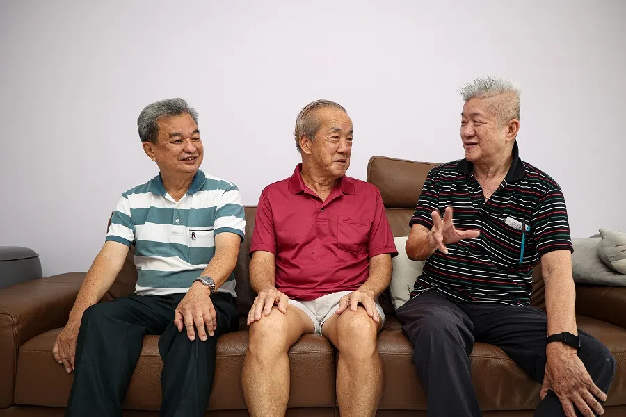 (from left) Toh Siam Ker, Yap Chin Hock and Kwek Chee Heng note how their tanghao plaques spark curiosity among visitors. They hope to inspire others to adopt this tradition, connecting neighbours and preserving cultural heritage.  (Jeremy Kwan/SPH Media)