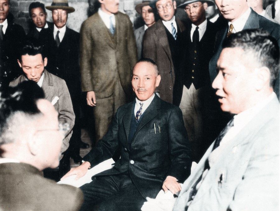Chiang Kai-shek, commander in chief of the National Revolutionary Army, at a press conference in the Longhua Club (龙华会) before his visit to Japan, 1927. On his right is his confidante Zhang Qun. The revolutionary army had launched a strong offensive towards the north, but issues with ideals and authority eventually led to two camps forming in the "Nanjing-Wuhan split". Chiang temporarily stepped down from the revolutionary army and went to Japan.