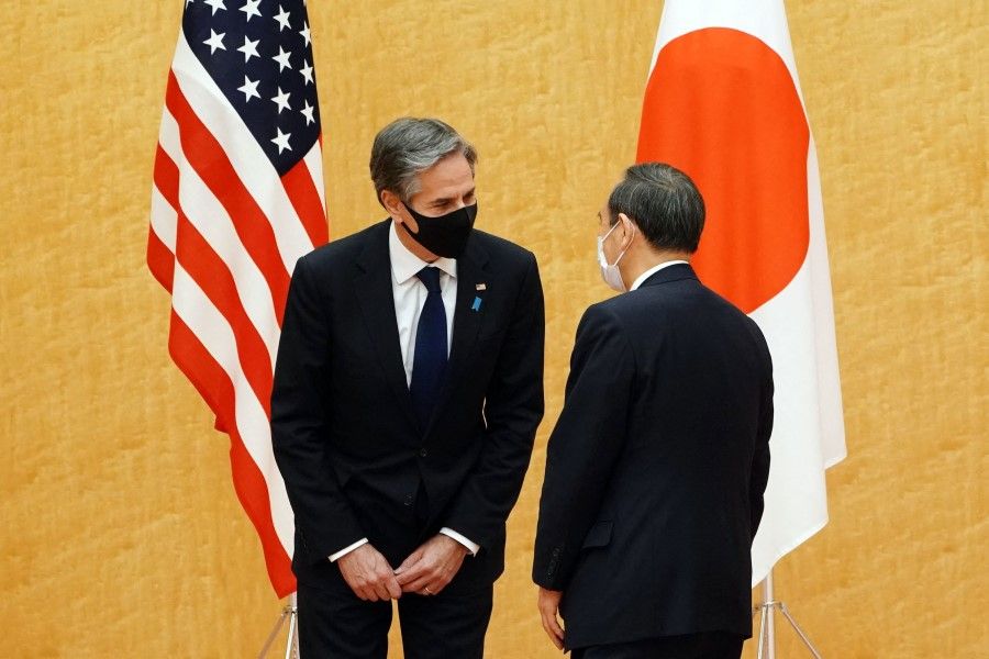 Japan's Prime Minister Yoshihide Suga (right) meets with US Secretary of State Antony Blinken during a courtesy call at the prime minister's official residence in Tokyo on 16 March 2021. (Eugene Hoshiko/AFP)