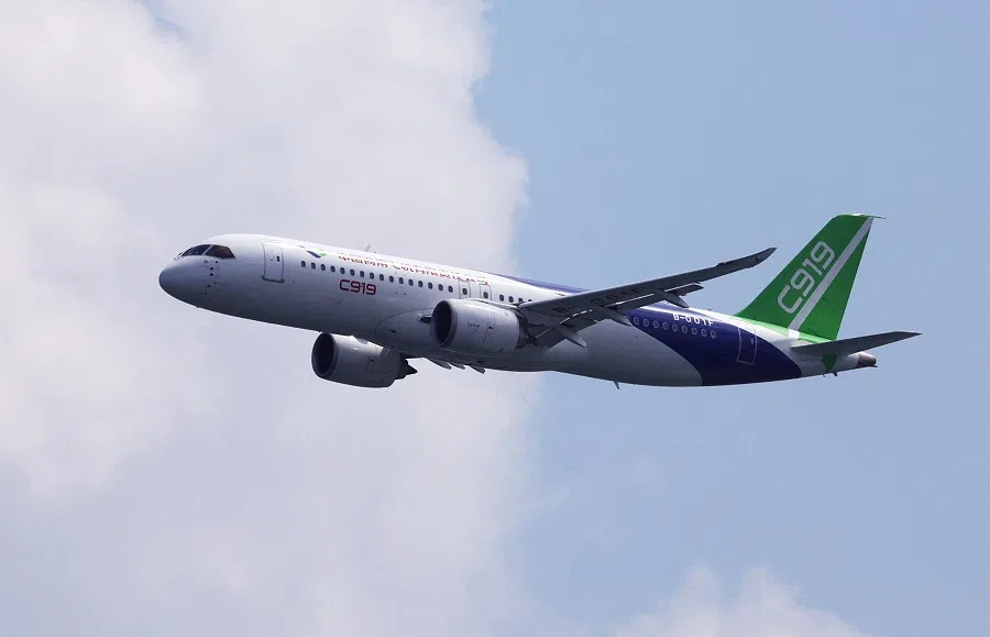 A COMAC C919 flies past during an aerial flying display ahead of the Singapore Airshow at Changi Exhibition Centre in Singapore, on 18 February 2024. (Edgar Su/Reuters)