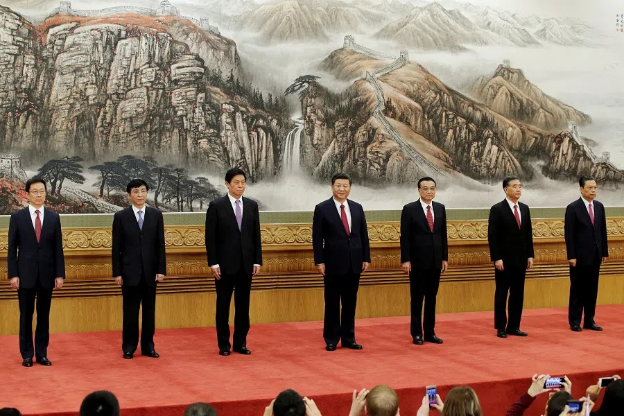 (left to right) China's 19th Politburo Standing Committee members Han Zheng, Wang Huning, Li Zhanshu, Xi Jinping, Li Keqiang, Wang Yang and Zhao Leji line up as they meet the press at the Great Hall of the People in Beijing, China, 25 October 2017. (Jason Lee/Reuters)