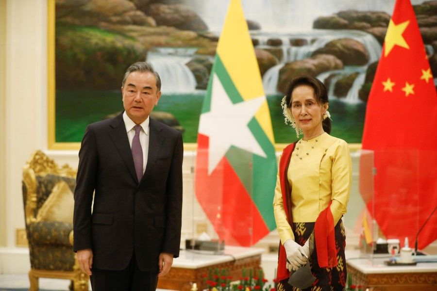 China's State Councilor and Foreign Minister Wang Yi and Myanmar's State Counsellor Aung San Suu Kyi in Naypyitaw, Myanmar, 11 January 2021. (Myanmar President Office/Handout via REUTERS)