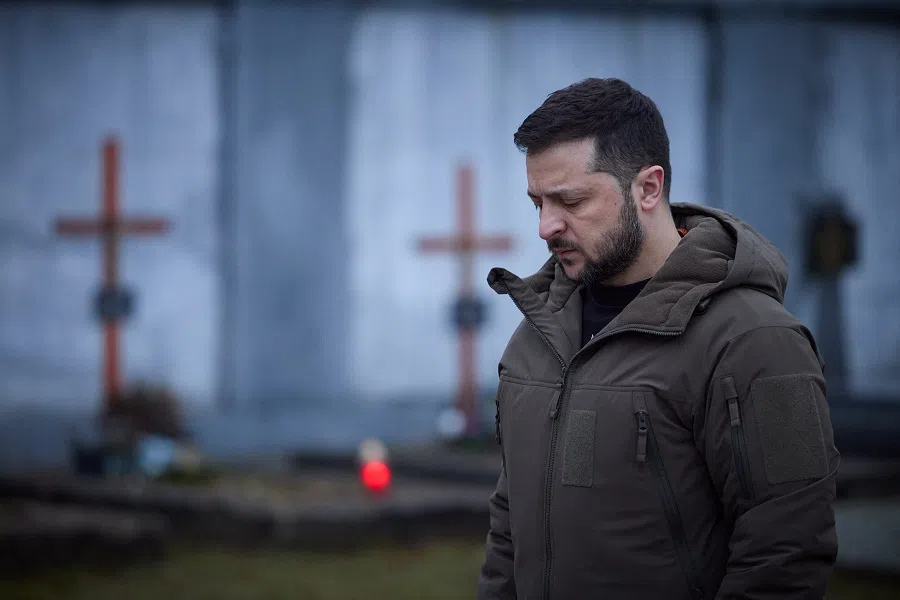 This handout picture taken and released on 11 January 2023 by the Ukranian Presidential Press Service shows Ukrainian President Volodymyr Zelenskyy paying tribute to fallen soldiers at the Field of Mars of Lychakiv Cemetery in the western city of Lviv, Ukraine, amid the Russian invasion of Ukraine. (Handout/Ukranian Presidential Press Service/AFP)