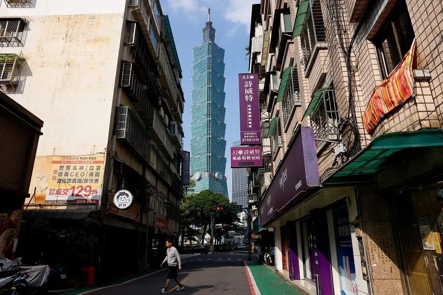 People and cars can be seen passing Taipei 101 in Taipei, Taiwan, on 17 April 2025. (Ann Wang/Reuters)