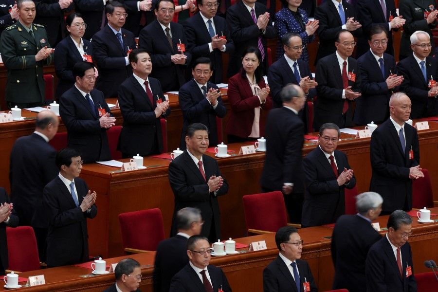 Chinese President Xi Jinping and other leaders attend the closing session of the National People’s Congress (NPC) at the Great Hall of the People in Beijing, China, on 11 March 2024. (Florence Lo/Reuters)