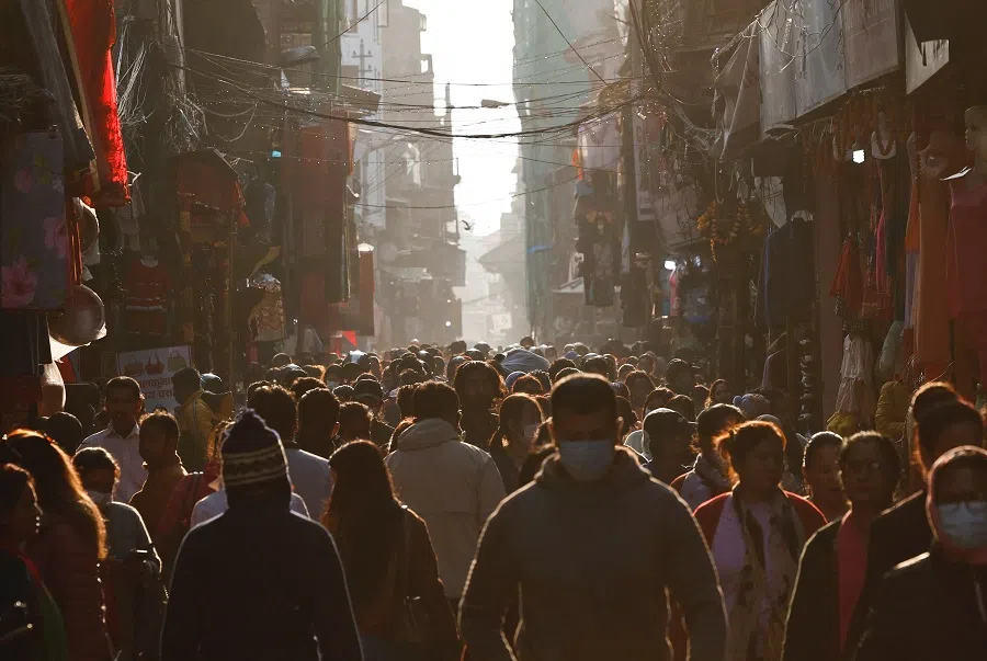 People walk on a street ahead of the general elections in Kathmandu, Nepal, 18 November 2022. (Navesh Chitrakar/Reuters)