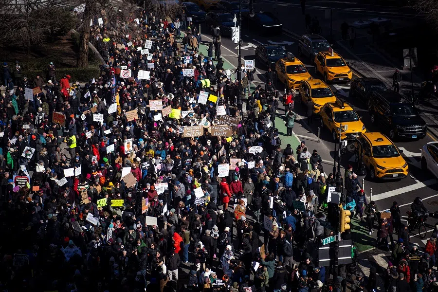 People start marching along the street as they participate in a National Day of Protest on Presidents’ Day in New York City, US, on 17 February 2025. (Eduardo Munoz/Reuters)