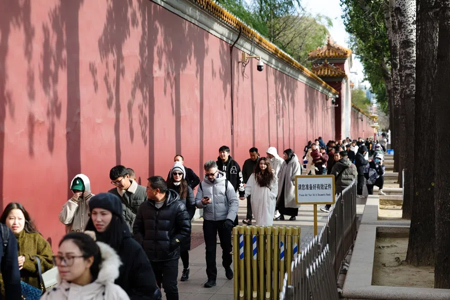 Tourists walk towards Tiananmen Square in Beijing, China, on 26 November 2024.