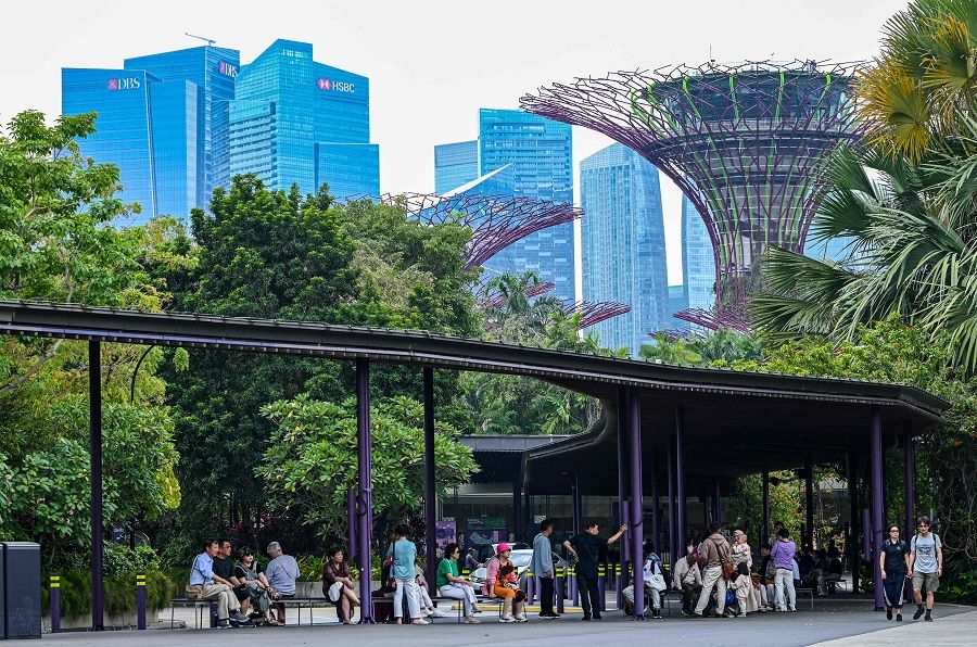 Visitors take a break under a shelter at Gardens by the Bay in Singapore on 11 March 2024. ( Roslan Rahman/AFP)