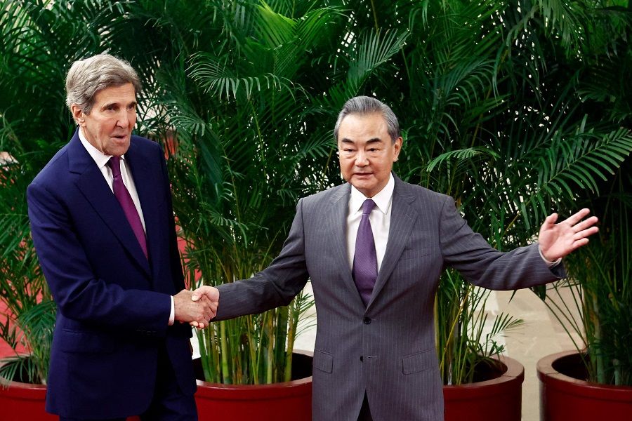 US special presidential envoy for climate John Kerry and Director of the Office of the Central Commission for Foreign Affairs Wang Yi (right) shake hands before a meeting at the Great Hall of the People in Beijing, China, on 18 July 2023. (Florence Lo/Pool/AFP)