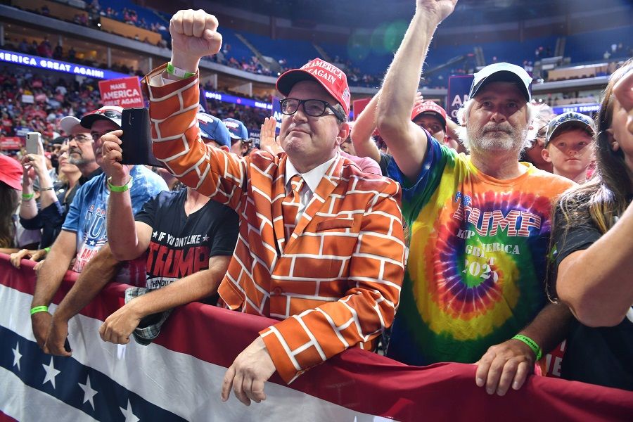 In this file photo, supporters cheer as they listen to US President Donald Trump speak during a campaign rally at the BOK Center on 20 June 2020 in Tulsa, Oklahoma. (Nicholas Kamm/AFP)