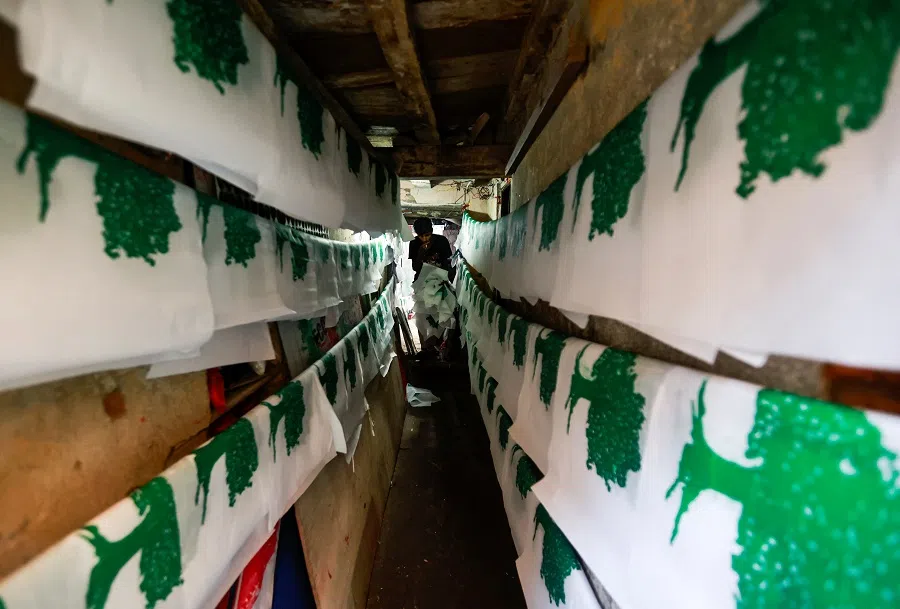 Newly printed election symbol posters of Nepali Congress party are hung at a printing shop ahead of the general election in Kathmandu, Nepal, 3 November 2022. (Navesh Chitrakar/Reuters)