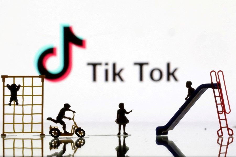 Children playground miniatures are seen in front of displayed TikTok logo in this illustration taken 4 April 2023. (Dado Ruvic/Reuters)