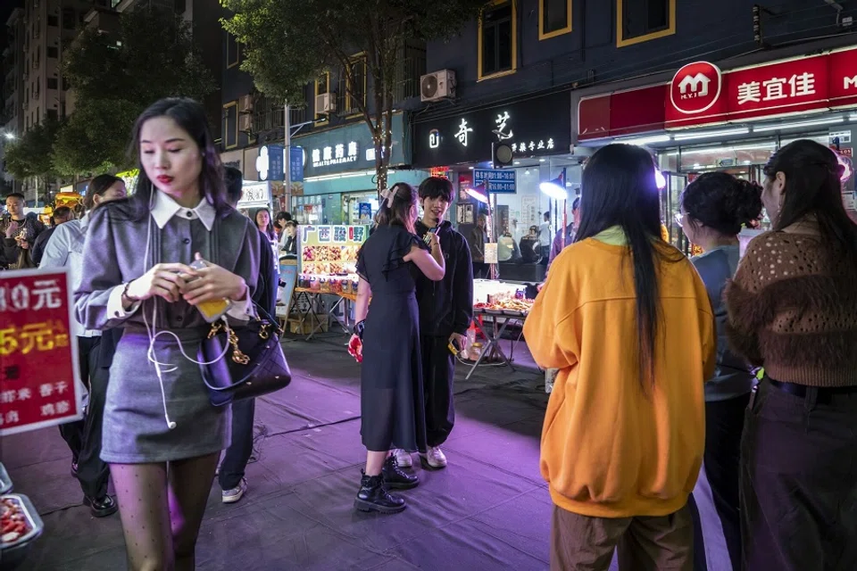 Pedestrians at the Dongmen Old Street shopping area in Shenzhen, China, on 18 January 2024. (Qilai Shen/Bloomberg)