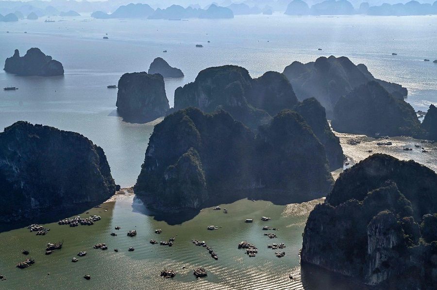 This aerial photo shows fishing boats sailing on the waters of Ha Long Bay in Vietnam's northeastern province of Quang Ninh on 28 December 2023. (Nhac Nguyen/AFP)