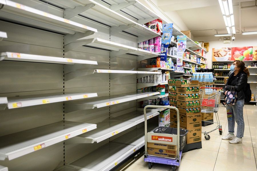 A photo taken on 5 February 2020 shows empty supermarket shelves used for stacking paper towels in Hong Kong. (Philip Fong/AFP)