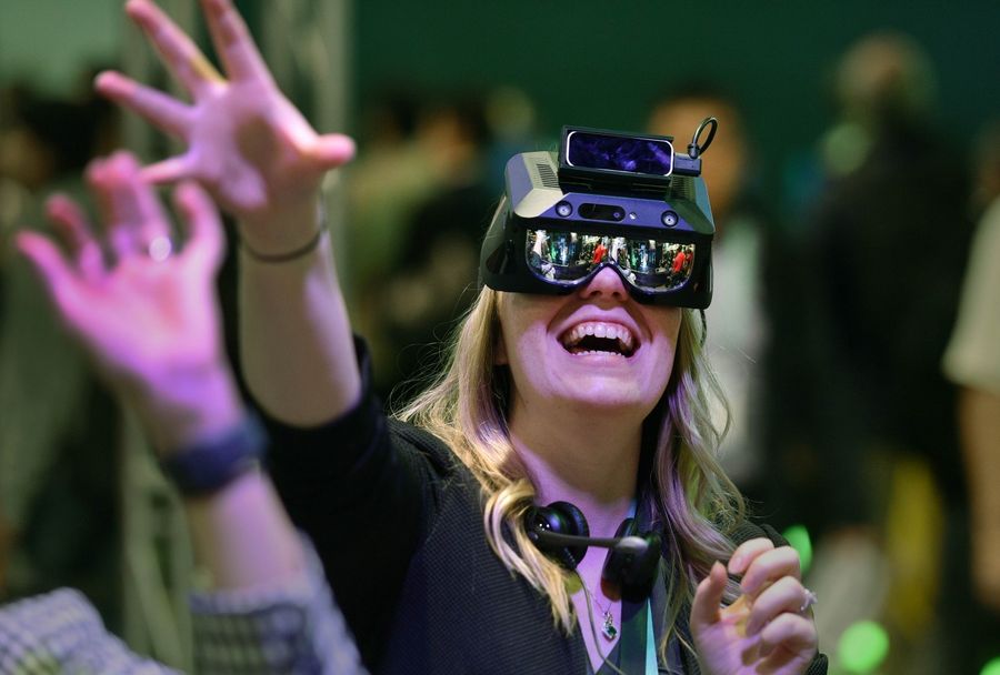 An attendee participates in an augmented reality exercise at the Realmax booth during CES 2020 at the Las Vegas Convention Center on 8 January 2020 in Las Vegas, Nevada. (David Becker/Getty Images/AFP)