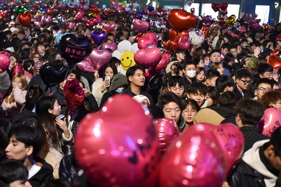 The photo taken on 31 December 2023 shows people attending a New Year celebration in Nanjing, Jiangsu province, China. (AFP)