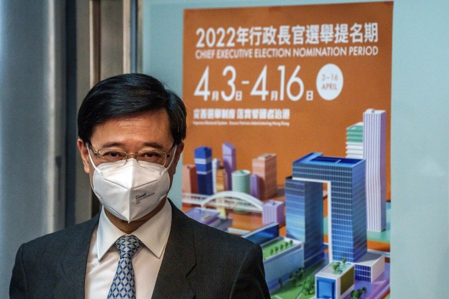 John Lee, Hong Kong's former chief secretary, poses for the media ahead of submitting his application for the upcoming Chief Executive election in Hong Kong, China, on 13 April 2022. (Lam Yik/Bloomberg)
