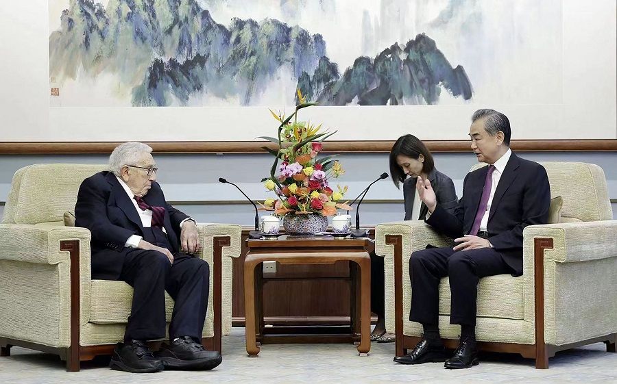 This handout picture taken and released by China's Ministry of Foreign Affairs on 19 July 2023 shows Director of the Office of the Central Commission for Foreign Affairs Wang Yi (right) speaking with former US Secretary of State Henry Kissinger during a meeting in Beijing, China. (Handout/China's Ministry of Foreign Affairs/AFP)