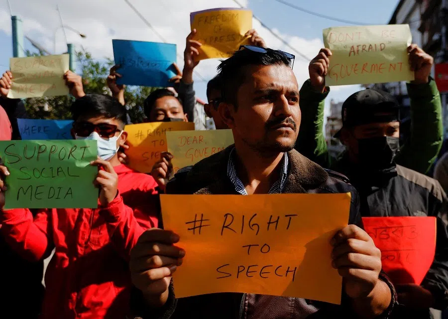 Participants holding placards take part in a protest against the ban on TikTok in Kathmandu, Nepal, 18 November 2023. (Navesh Chitrakar/Reuters)