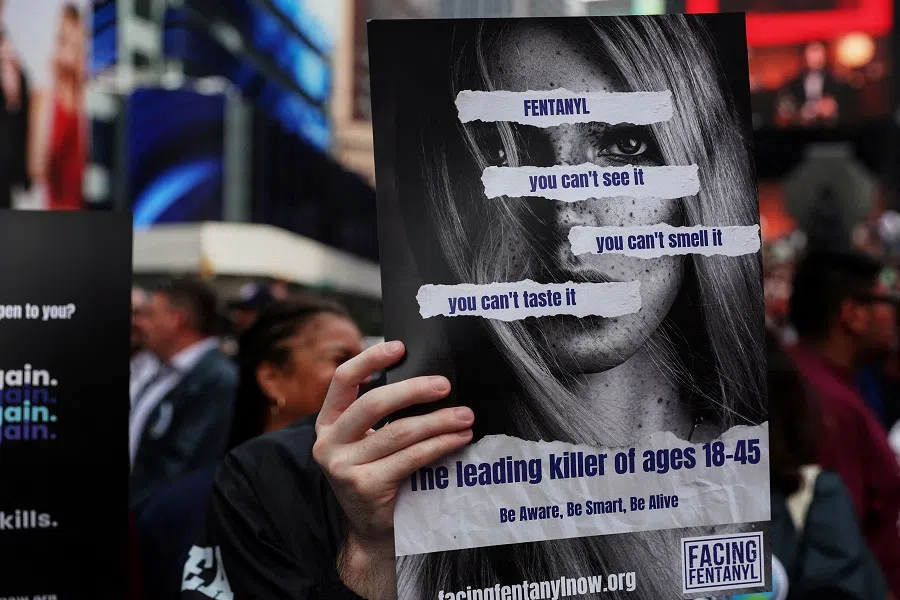 A person holds a sign attending the Facing Fentanyl, a not-for-profit awareness group composed of families affected by fentanyl, second annual National Fentanyl Prevention and Awareness Day at Times Square in New York City, US, on 21 August 2023. (Shannon Stapleton/Reuters)