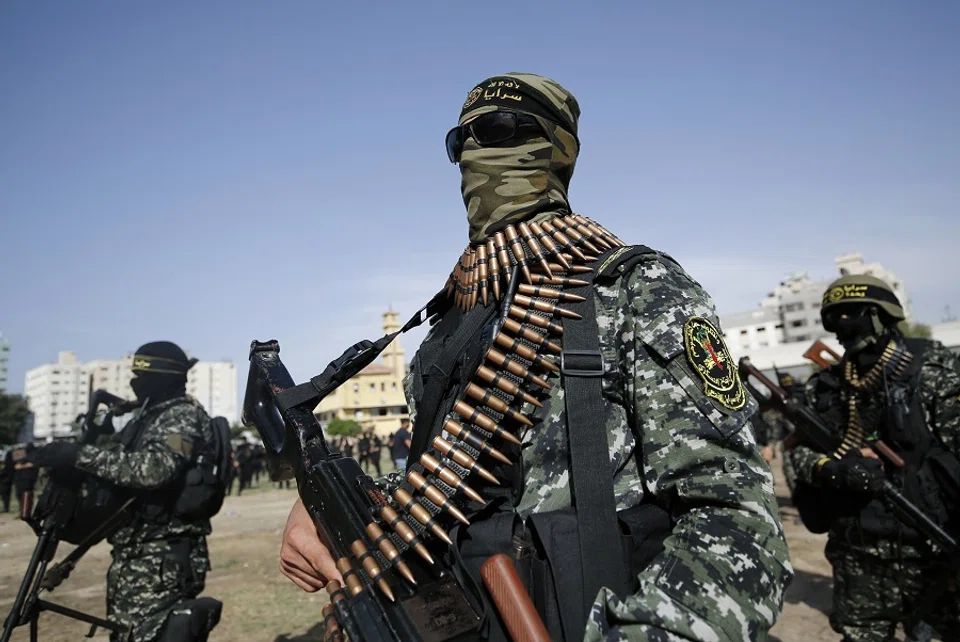 Members of the Palestinian Islamic Jihad militant group take part in a military parade during a condolences ceremony for the movement's former leader Ramadan Shalah in Gaza city, on 8 June 2020, two days after his death in neighbouring Lebanon. (Mohammed Abed/AFP)