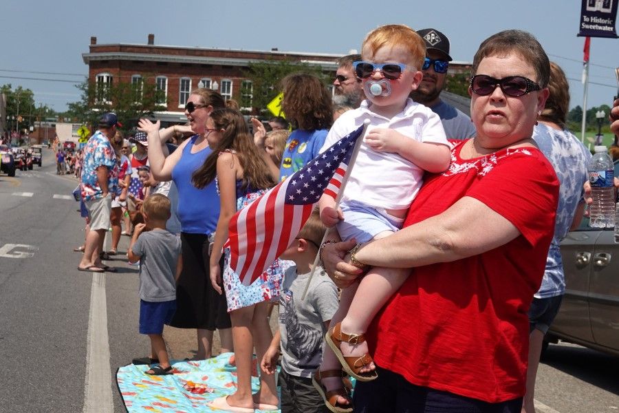 Residents and visitors line Main Street to watch the Independence Day parade on 4 July 2021 in Sweetwater, Tennessee. (Scott Olson/Getty Images/AFP)