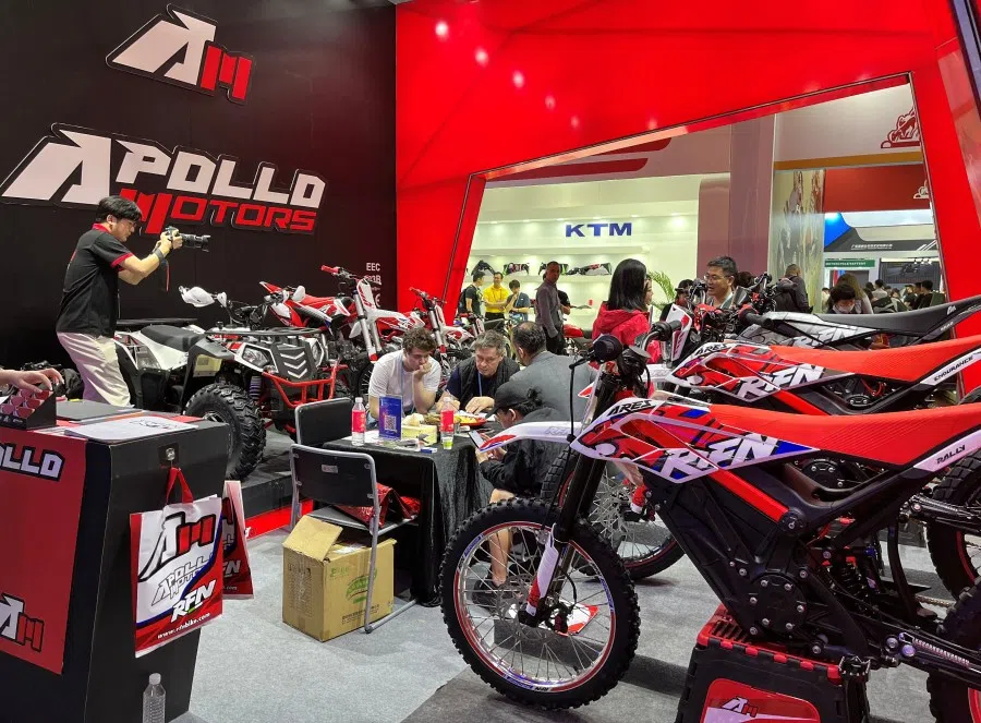 People visit the booth of Apollo Motors at the China Import and Export Fair, also known as Canton Fair, in Guangzhou, Guangdong province, China, 15 April 2023. (Ellen Zhang/Reuters)