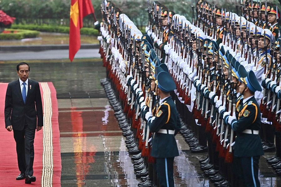 Indonesia's President Joko Widodo inspects the guard of honour during a welcoming ceremony at the Presidential Palace in Hanoi on 12 January 2024. (Nhac Nguyen/AFP)