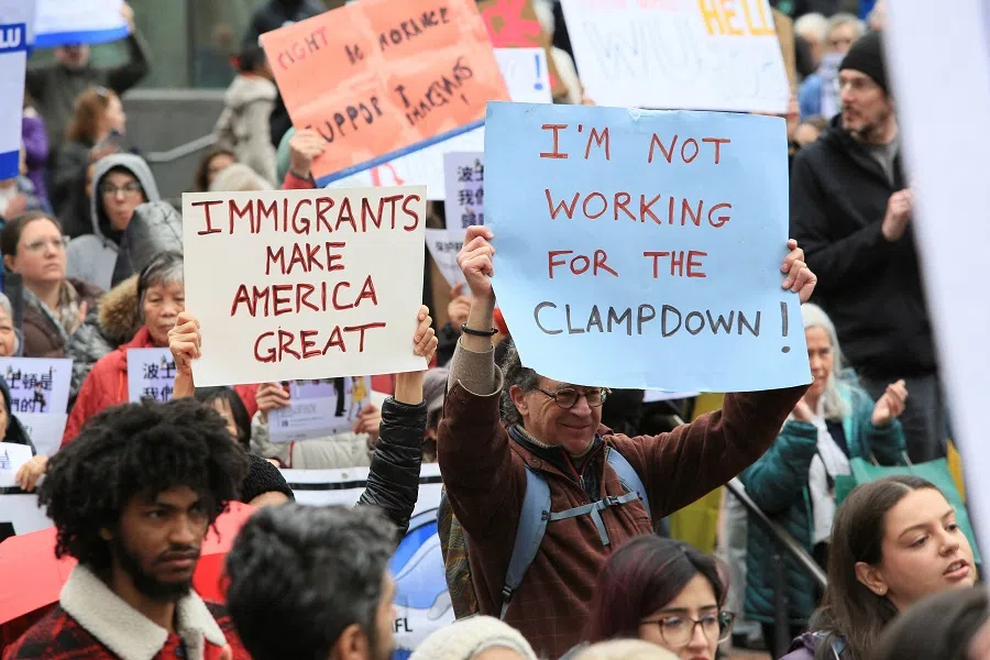 Demonstrators cheer and hold signs to support Boston Mayor Michelle Wu who is testifying in Congress, during a pro-immigration rally in Boston, Massachusetts, US, on 5 March 2025. (Lauren Owens Lambert/Reuters)