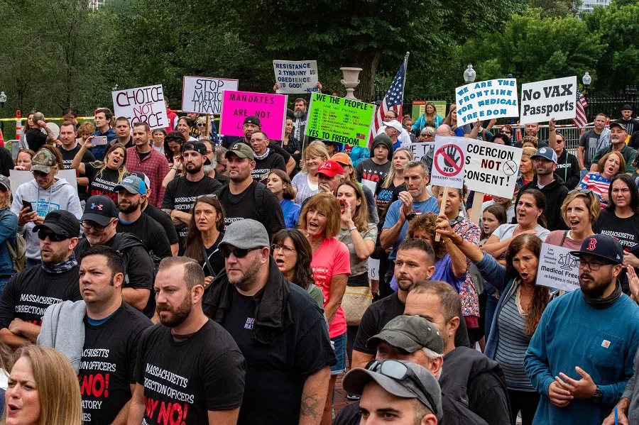Demonstrators gather outside the Massachusetts State House in Boston, US, to protest Covid-19 vaccination and mask mandates. (Joseph Prezioso/AFP)