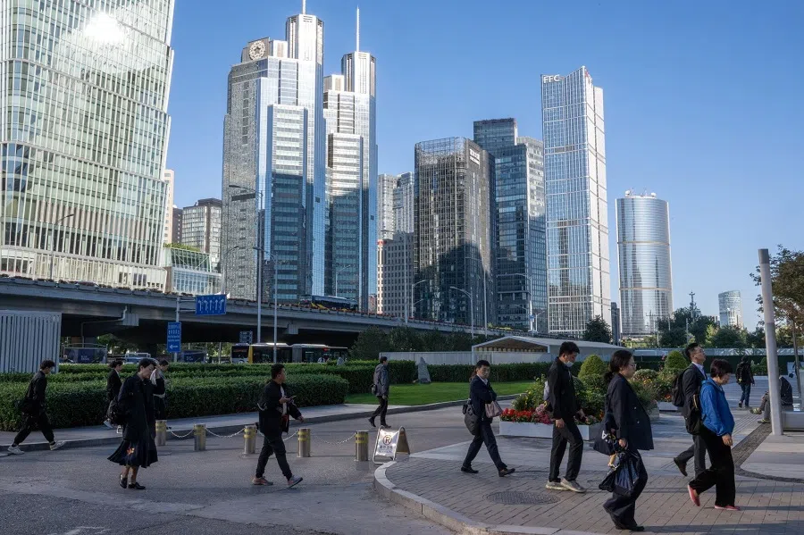 Pedestrians in Beijing, China, 8 October 2024. (Gilles Sabrie/Bloomberg)