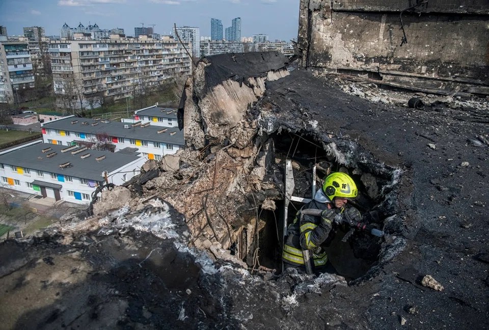 A firefighter works at a site an apartment building hit by a Russian drone strike, amid Russia’s attack on Ukraine, in Kyiv, Ukraine on 23 March 2025. (Vladyslav Musiienko/Reuters)