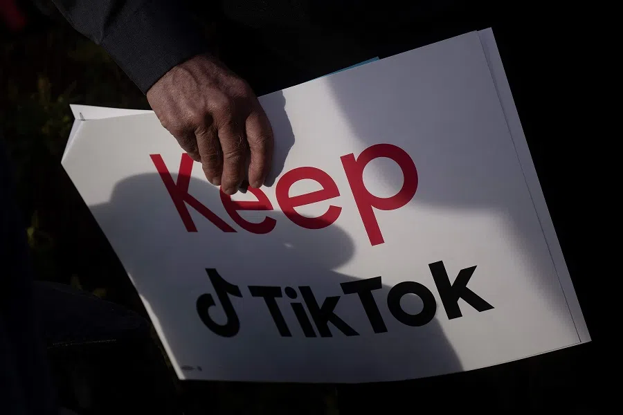 A person holds a sign during a press conference about their opposition to a TikTok ban on Capitol Hill in Washington, DC, US, on 22 March 2023. (Brendan Smialowski/AFP)