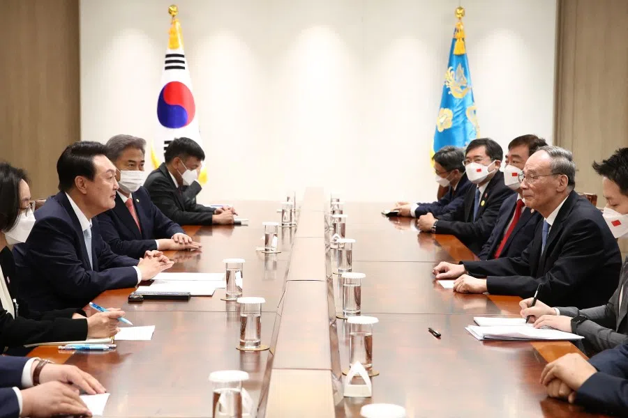 South Korea's President Yoon Suk-yeol (left) meets with China's Vice-President Wang Qishan (right) after his inauguration ceremony at the presidential office in Seoul on 10 May 2022. (Chung Sung-Jun/AFP)