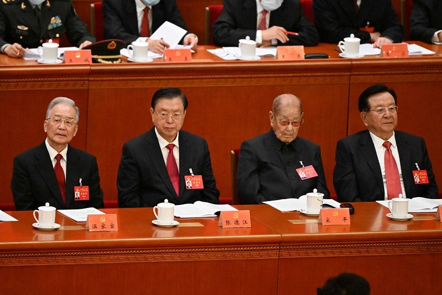 Left to right: China's former premier Wen Jiabao, former chairman of the Standing Committee of China's National People's Congress (NPC) Zhang Dejiang, former Politburo Standing Committee member Song Ping and former vice president Zeng Qinghong attend the opening session of the 20th Party Congress at the Great Hall of the People in Beijing, China, on 16 October 2022. (Noel Celis/AFP)