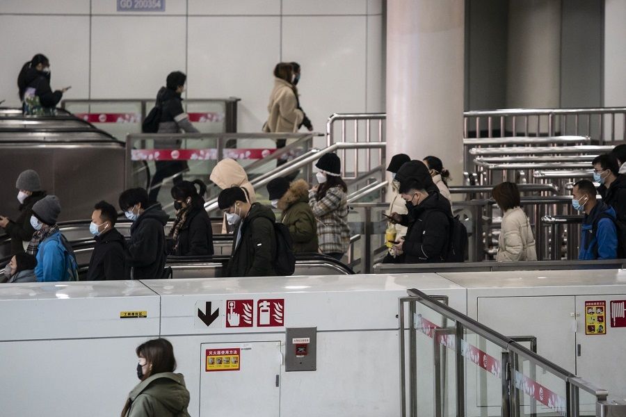 Commuters at a subway station in Shanghai, China, on 3 January 2023. (Qilai Shen/Bloomberg)