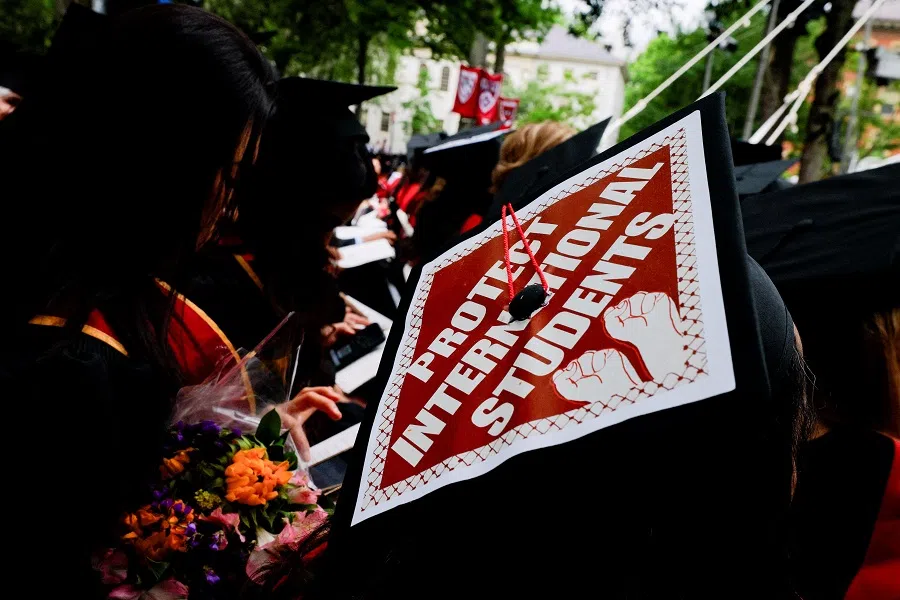 A graduating student wears their hat, decorated with a statement of support for international students, during the 374th Commencement exercises at Harvard University in Cambridge, Massachusetts, US, on 29 May 2025.