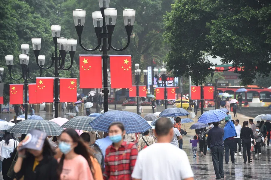 People walk along a street in Chongqing on 1 October 2020. (CNS)