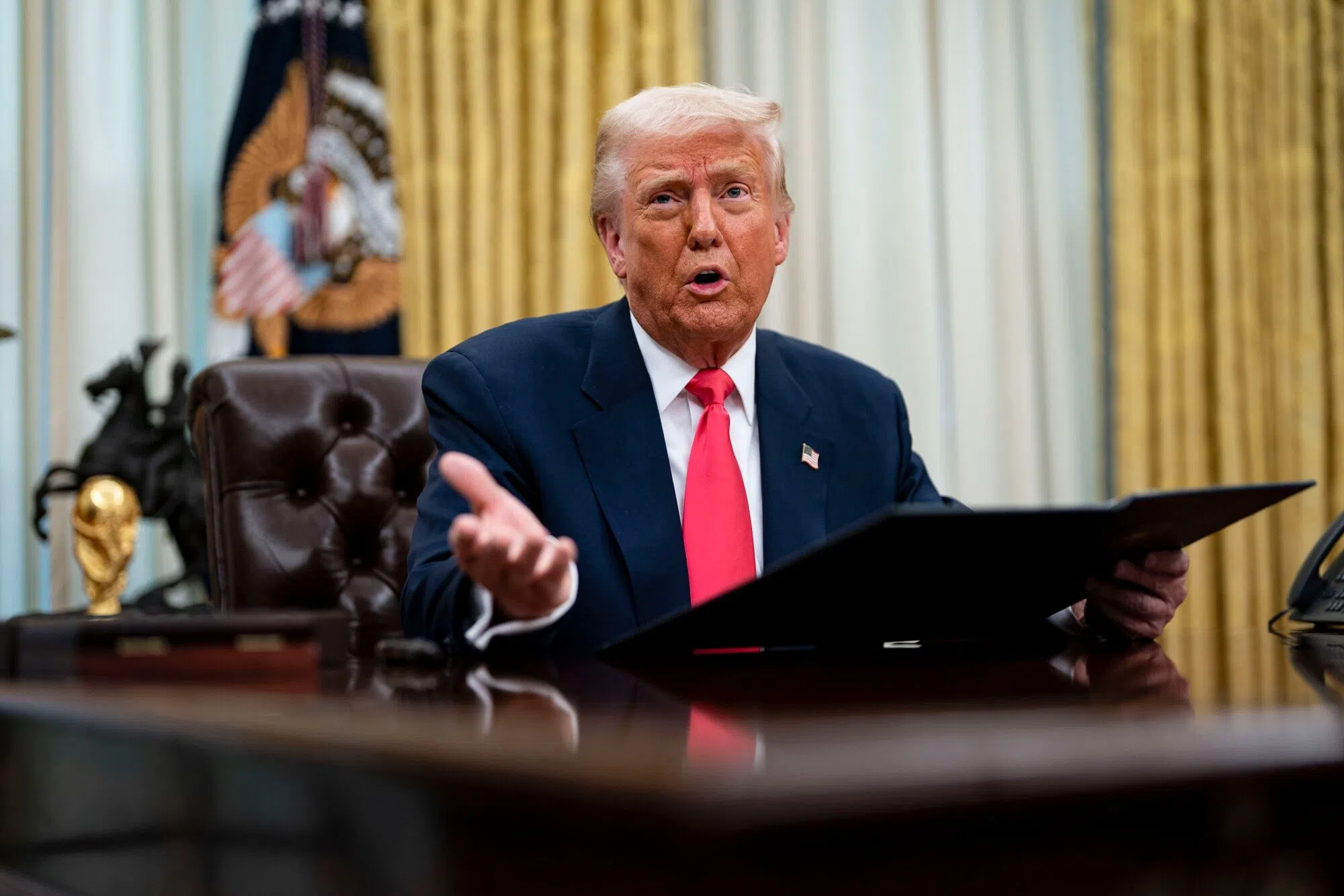 US President Donald Trump speaks during an executive order signing ceremony in the Oval Office of the White House in Washington DC, US, on 6 March 2025. (Al Drago/Bloomberg)