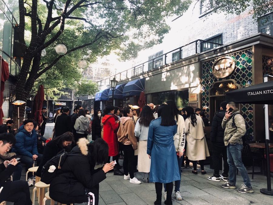 Queues that last for hours on end are characteristic of first stores. Pictured here is a long queue outside Taotaoju Restaurant.
