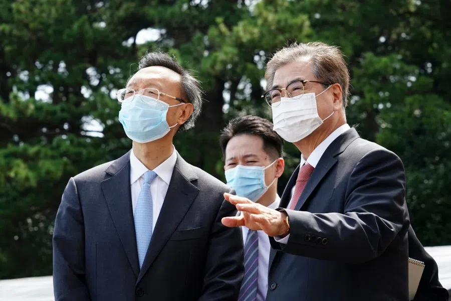 South Korea's national security adviser Suh Hoon (R) walks with Yang Jiechi (L), a member of the Political Bureau of the Communist Party of China's (CPC) Central Committee, after their meeting at a hotel in Busan on 22 August 2020. (Photo by - / YONHAP / AFP