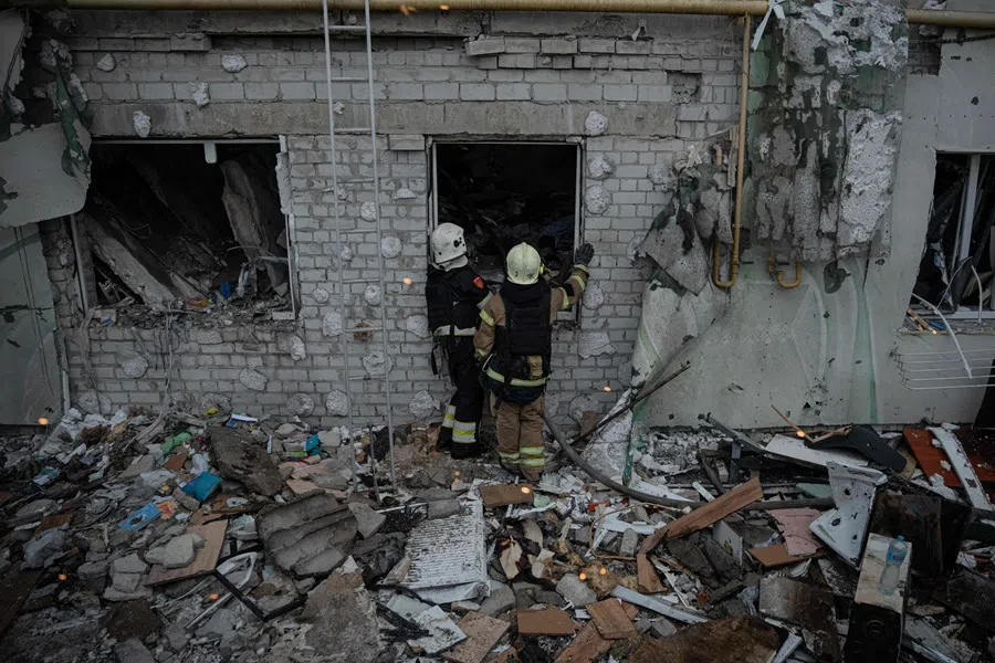 Ukrainian rescuers check a destroyed residential building after an air attack in Kharkiv, on 18 August 2025, amid the Russian invasion of Ukraine. (Ivan Samoilov/AFP)