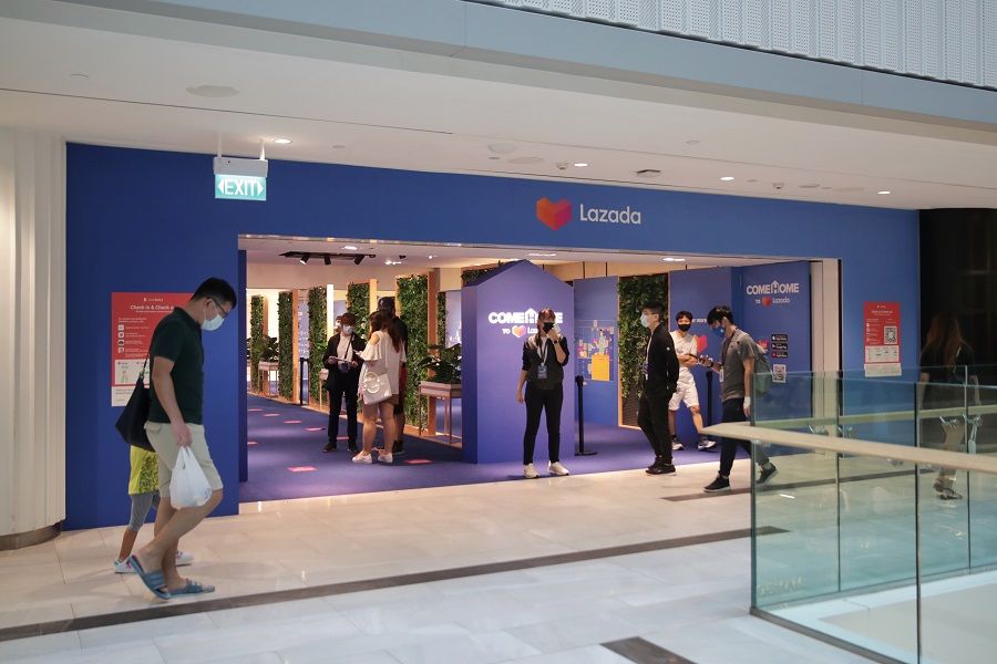 Shoppers browsing home decor items and appliances at the newly opened Lazada store located in Raffles City, Singapore on 3 April 2021. (SPH)