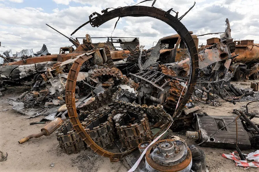 Destroyed Russian tanks and military vehicles are seen dumped in Bucha amid Russia's invasion in Ukraine, 16 May 2022. (Jorge Silva/Reuters)