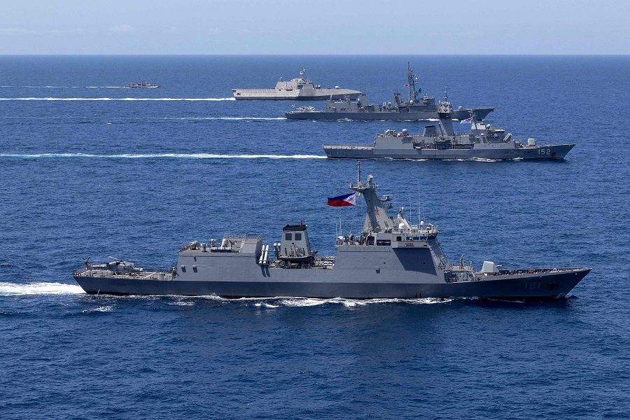 A handout photo taken on 7 April 2024 and received from the Australian Department of Defence on 8 April shows the USS Mobile, JS Akebono, HMAS Warramunga, BRP Antonio Luna and BRP Valentine Diaz sailing in formation during a multilateral maritime cooperative activity between Australia, the United States, Japan and the Philippines off the coast within the Philippines Exclusive Economic Zone. (Leo Baumgartner/Australian Department of Defence/AFP)