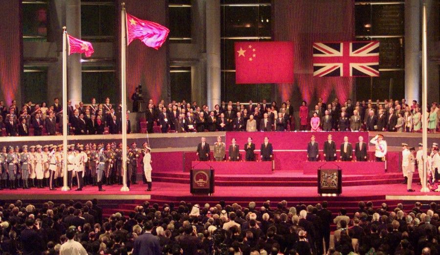 Raising of the Chinese and Hongkong Special Administrative Region (SAR) flags during the handover ceremony of Hong Kong, 1 July 1997. (SPH Media)